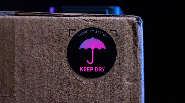 Humidity status label on cardboard box for retail and e commerce tech packaging to keep dry and safe during shipping