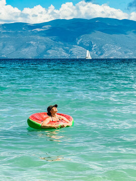 Person floating on ring in Adriatic sea