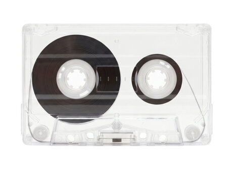 Clear audio cassette tape with magnetic ribbon visible on white background