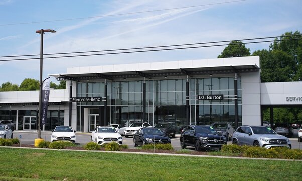 Milford, Delaware, U.S.A - Aug 1, 2026 - The I.G Burton Mercedes-Benz dealership with modern architecture, glass facade, and multiple luxury vehicles parked outside