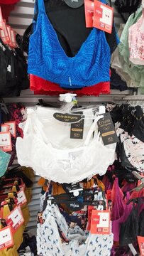 Royan, France - July 25, 2026: E.Leclerc ROYAN CEDEX. Colorful women's bras displayed on a retail rack with price tags and various styles visible in a clothing store setting