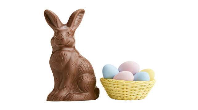 Brown chocolate Easter bunny beside yellow basket with pastel eggs, isolated on transparent background