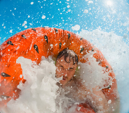 Man splashing on float in Adriatic sea