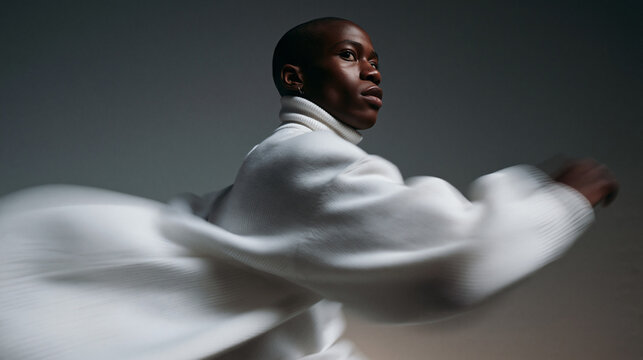 Stylish Black Model Posing in Motion Wearing White Sweater