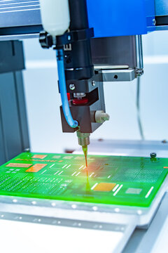 Robot holding glue syringe Injection and assembly pcb board
