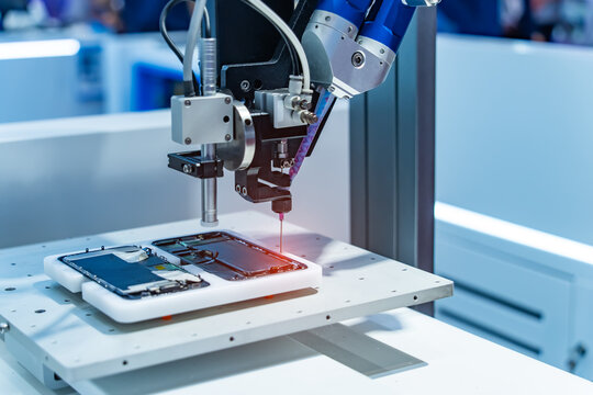 Robot holding glue syringe Injection in mobile phone factory