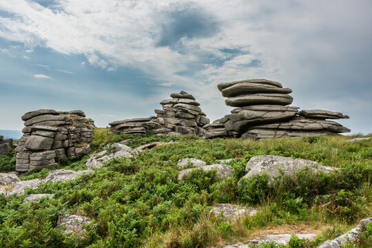 Lovely Summer day landscape image of Rough Tor on Bodmin Moor in English countryside