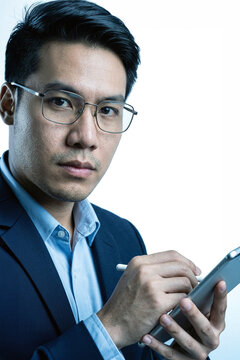 Professional man using a tablet with a stylus