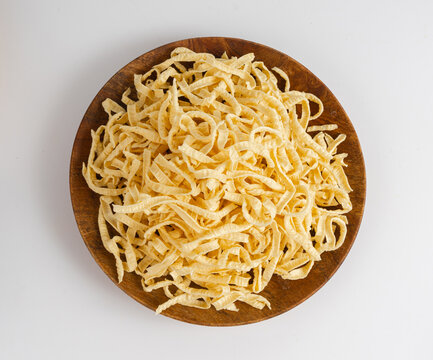 Passatelli spatzle pasta isolated, raw spaetzle noodles, dry homemade german macaroni