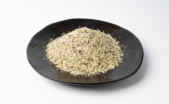 Shelled hemp seeds pile isolated, peeled cannabis grains, marijuana kernels without peel
