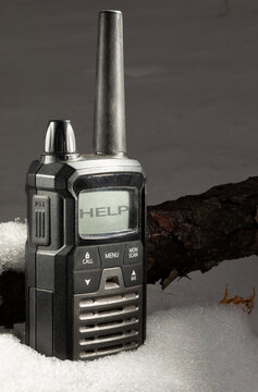 Help message on the sceen of a walkie-talkie in the snow
