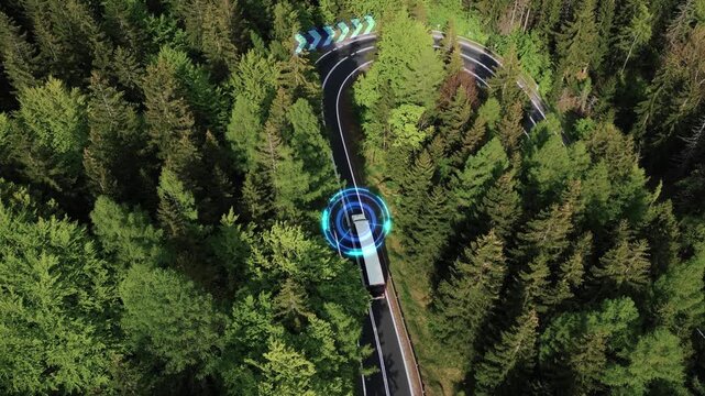 Concept of smart autonomous cargo transport. A self-driving truck with a trailer is driving along a mountain road without a driver. Sensors scan the road. GPS navigation. 4k footage
