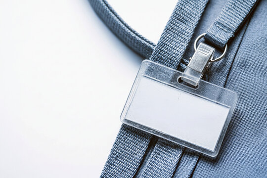 Blank ID badge holder with clip on a grey lanyard