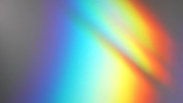 Soft rainbow refraction and blurred defocused light streaks appear on a dark abstract background. Concept digital design, banners, websites, advertising and editorial layouts.