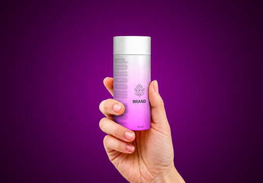 Cosmetic Tube Bottle Mockup Held by Hand on Purple Background