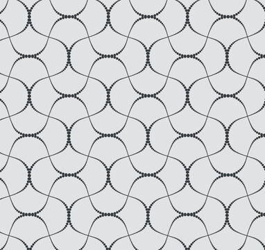 Seamless vector pattern of delicate dotted wavy lines forming an abstract geometric mesh on a gray background. Elegant tile for textile and wallpaper.