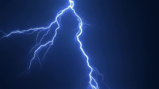 A bright jagged bolt of lightning strikes across a dark blue stormy night sky.