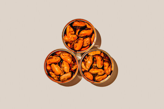 top view of three tins of mejillones en escabeche