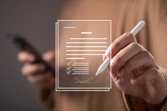 Close-up of a person signing a digital document on a virtual interface using an electronic signature. Online contracts, secure authentication, paperless workflow, compliance, and business technology.