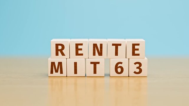 German text "Rente mit 63" (pension from age 63) built with toy cubes. A pension reform is in discussion in Germany. Camera tilt and move