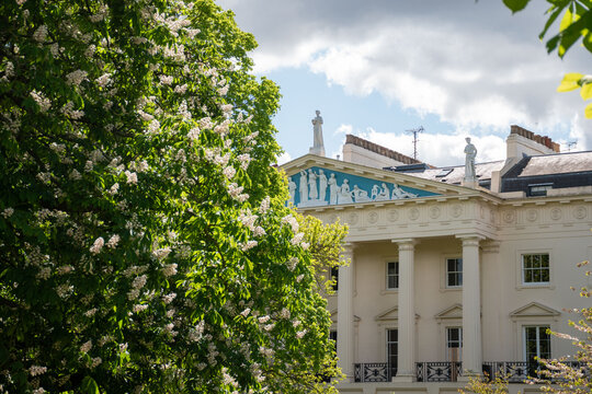 London, UK - 18 April 2026. Neoclassical Cumberland Terrace in London, designed by John Nash in 1826, showcasing British Regency architecture with classic sculptures and a blue pediment.