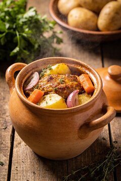 Slow Cooked Rustic Pot Roast with Vegetables in Traditional Clay Pot