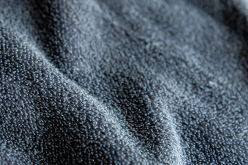Dark Grey Microfiber Fabric Texture Background with Soft Waves © chaophrayaart