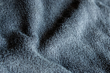 Dark Grey Microfiber Fabric Texture Background with Soft Waves © chaophrayaart