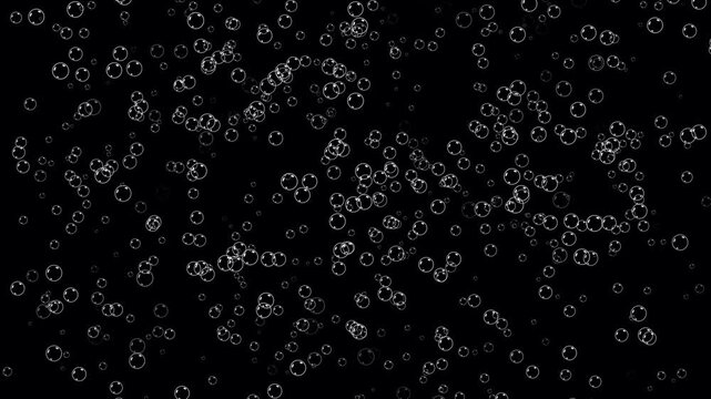 Water bubbles moving from bottom to top. Rising bubbles under transparent water. Rising air bubbles on black background. Gas bubbles floating of champagne. Soap bubbles fly up overlay in close up.