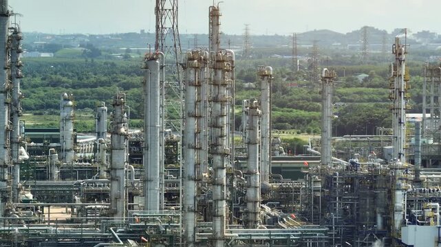 Aerial view of a petrochemical plant featuring complex pipe networks, refining units, and industrial infrastructure highlighting chemical processing capacity, asset reliability, modernization efforts.