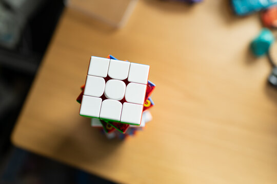 Bangkok, Thailand - July 23, 2026 : Modern Stickerless Magnetic Rubiks Speedcube Puzzle Toy with Colored Plastic for Fast Playability resting on wooden table.