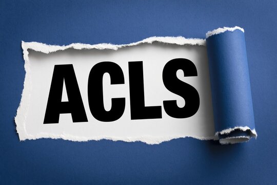 Acls word written under torn blue paper medical background
