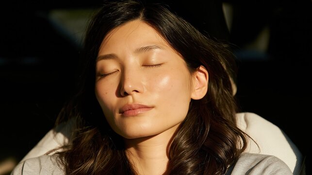 A woman sleeping in a car creates a calm lifestyle visual emphasizing comfort, safety, and modern transportation.