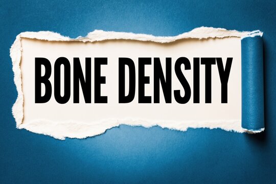 Black text bone density written under torn blue paper