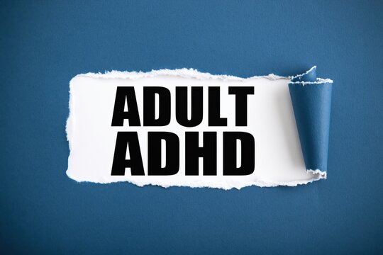 Black text adult adhd written under torn blue paper