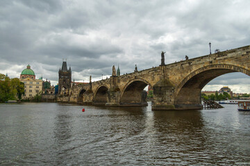 Obraz premium Historic Charles Bridge spanning the Vltava River in Prague