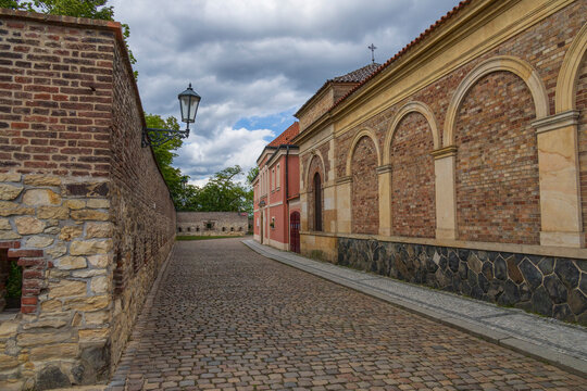 View of a cobblestone pathway on &Scaron;tulcova Street within the historic Vy&scaron;ehrad fortress in Prague
