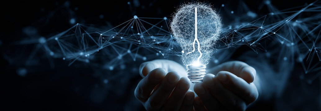 person's hands are cupped together, holding a luminous digital lightbulb. the lightbulb's design is split
