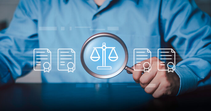 Legal audit, compliance vetting, professional corporate law investigation, and judicial system verification concept. Businessman holding magnifying glass focusing on scales of justice icon.