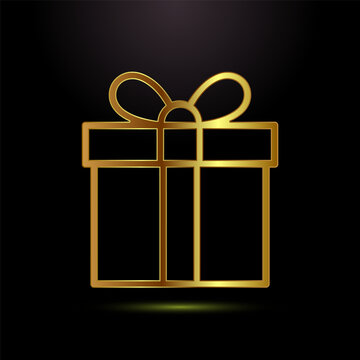 Golden gift box with ribbon on black background ideal for celebrations and special events.