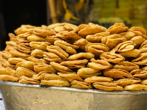 Traditional Khaja Sweet Crispy Pastry Display at Local Street Food Market
