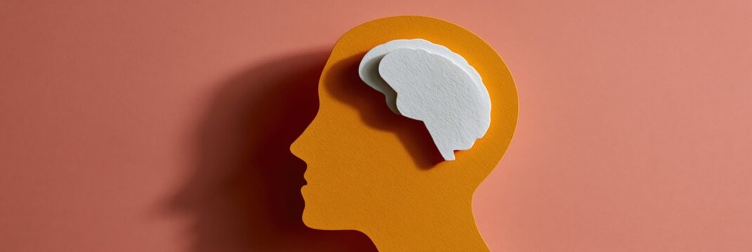 Paper cut concept of human head with white brain silhouette on coral background for mental health infographic and medical poster design