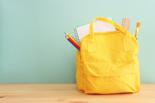 Back to school concept over pastel background. Top view
