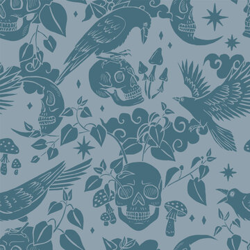 Seamless pattern with hand drawn blue raven or crow silhuette sitting on skulls. Monochrome skeleton heads in forest nettles repeat background. Halloween celestial birds print