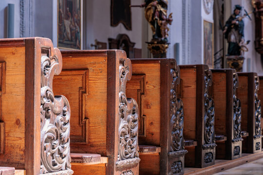 Carved Wooden Church Pews in Historic Christian Church Interior