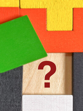 Question Mark Covered by Green Block Representing Hidden Information and Uncertainty