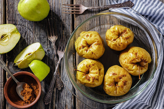 Whole Baked green apples in a glass baking dish