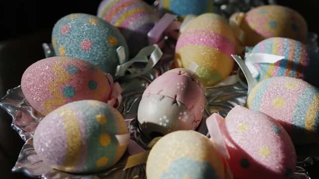Decorative easter eggs with glitter and ribbons in playful pastel colors for spring holiday decoration.