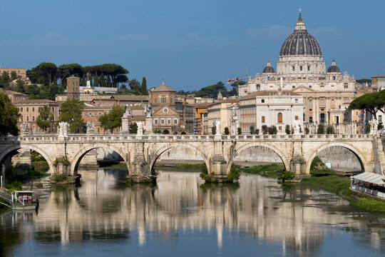St. Peter's cathedral over bridge and river in Rome, Italy