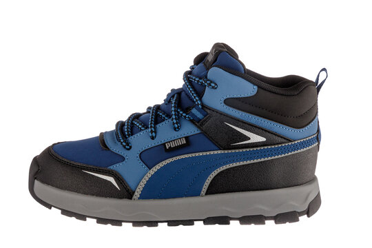 Varna , Bulgaria - November 11, 2025 :Puma Kids Blue Water-Repellent High-Top Sneakers, Durable Outdoor Winter Boots for Children, Isolated on White Background